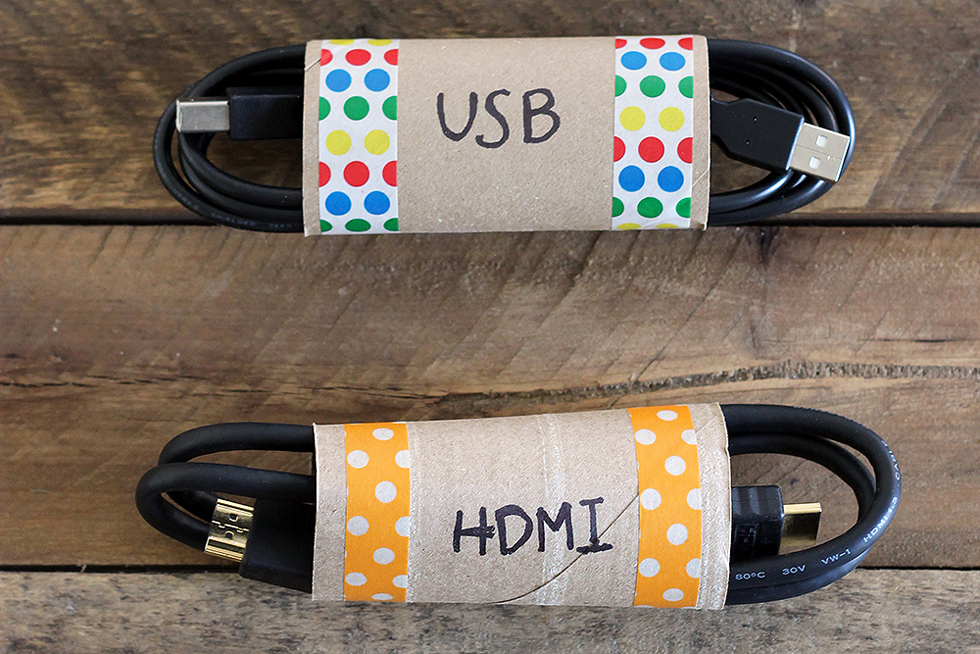 HDMI cord and a USB cord in cardboard toilet paper holders