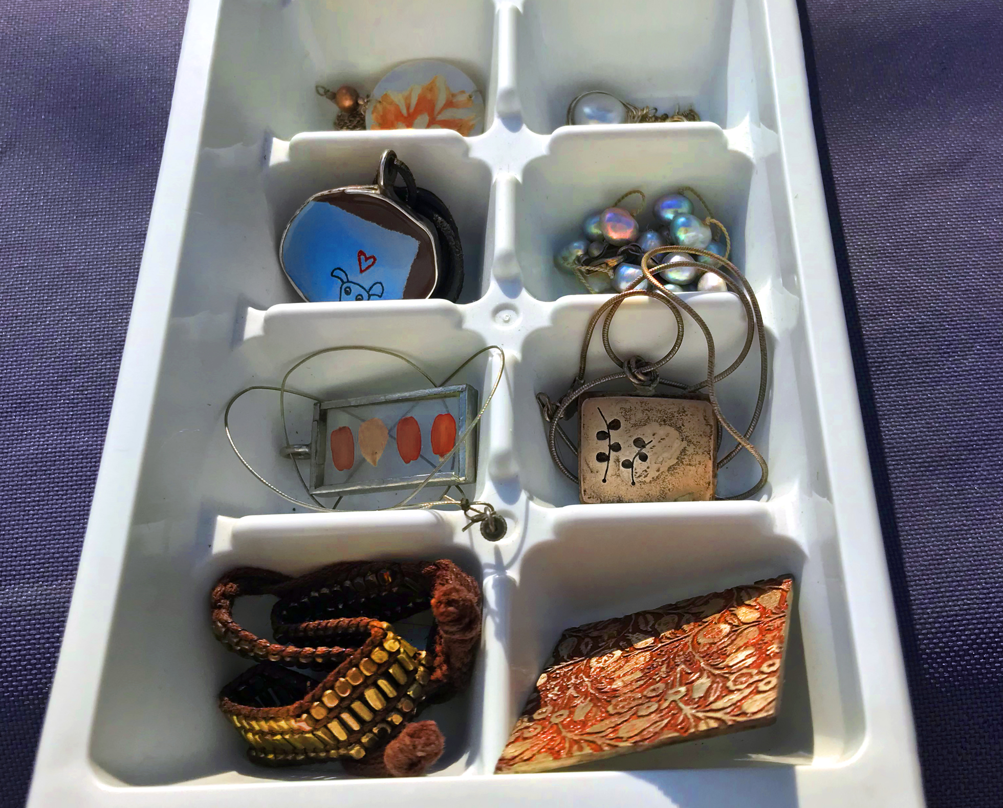 Ice cube tray used as to declutter jewelry storage