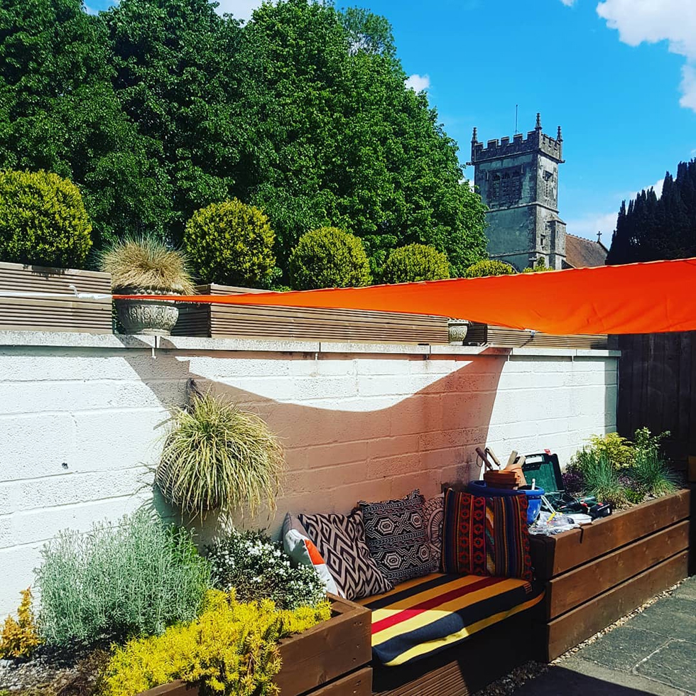Shade sail over a summer back patio