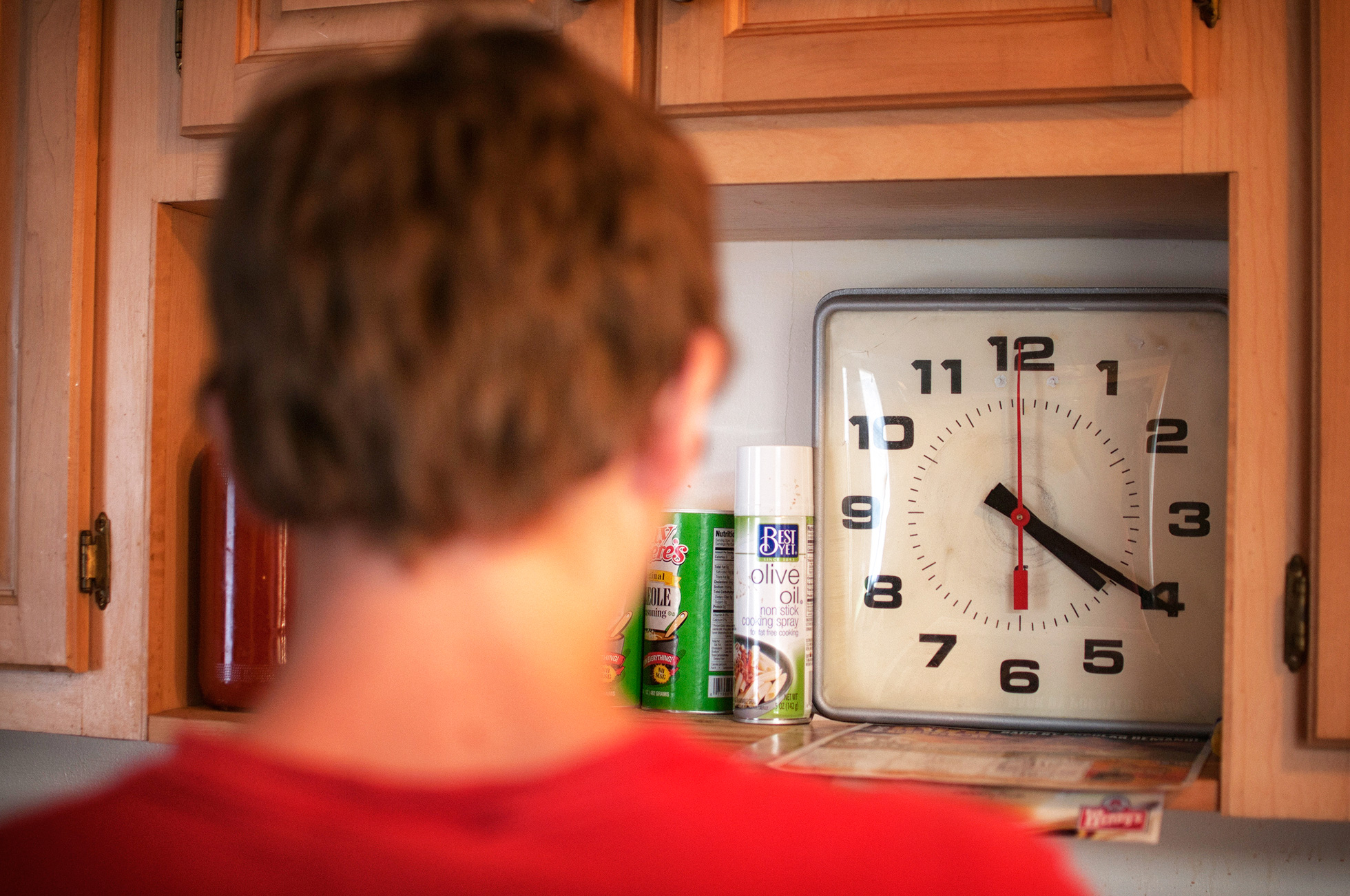 Man looking at a clock
