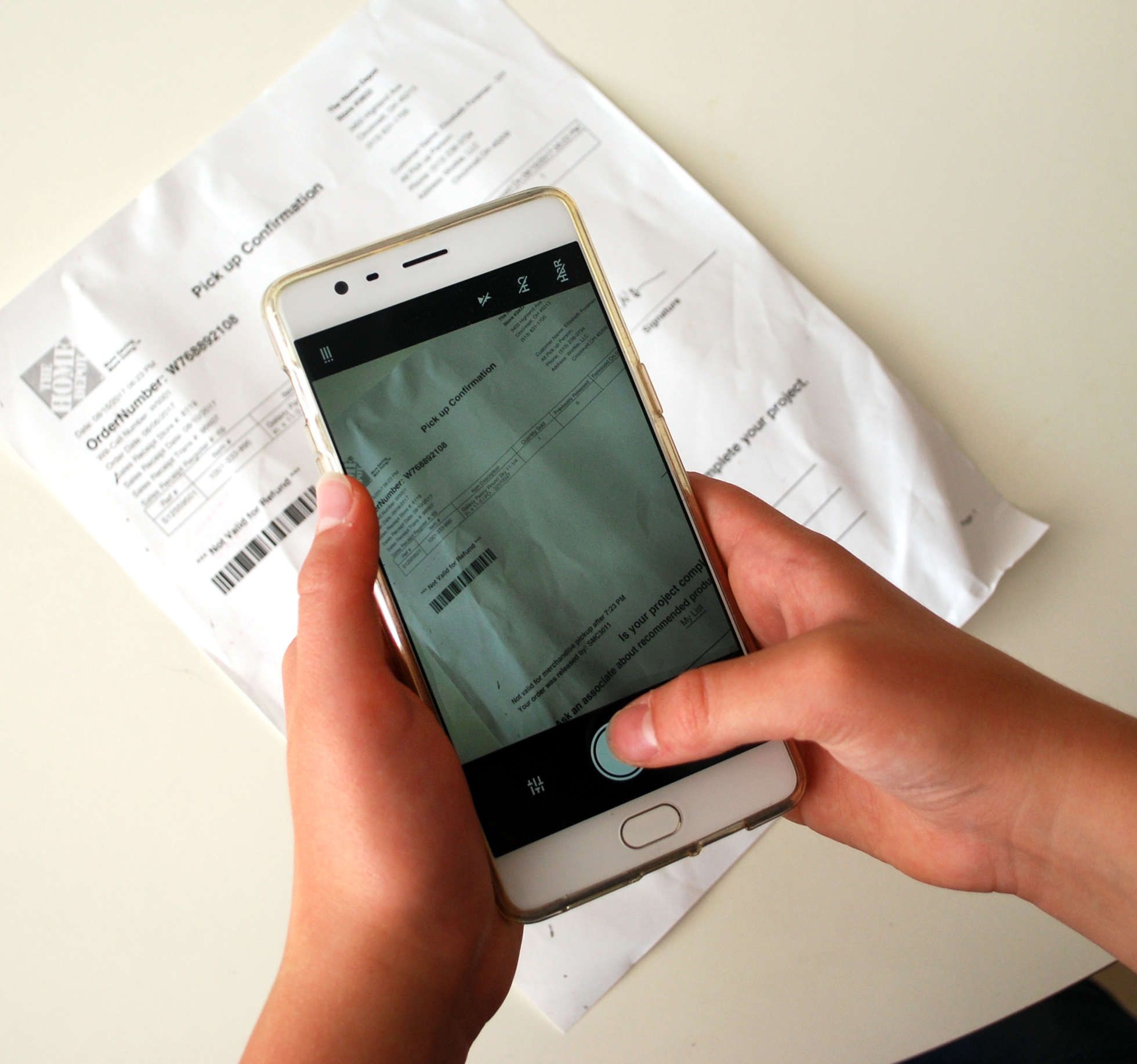 Taking a cell phone photo of important paperwork