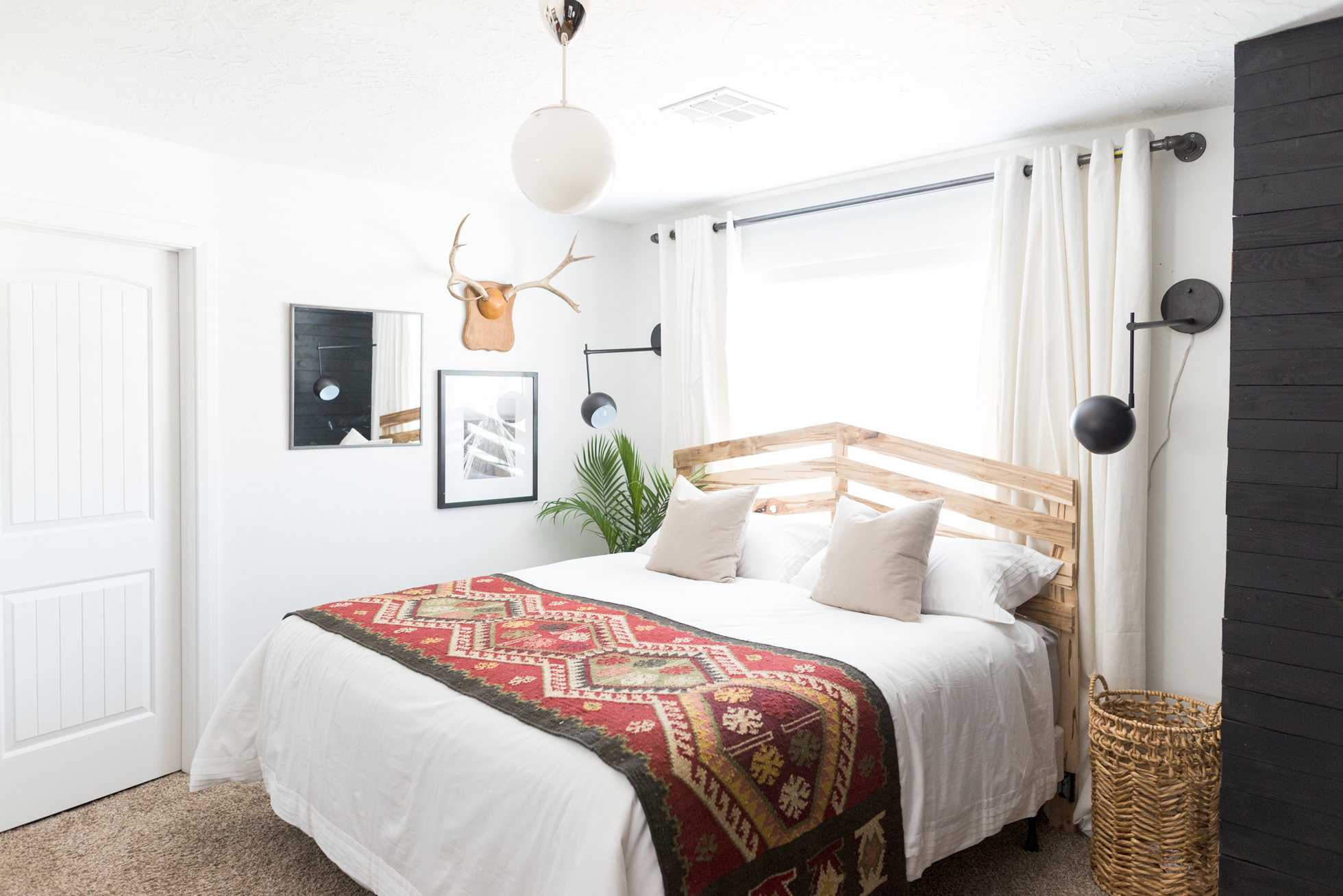 White bedroom with wooden bed frame