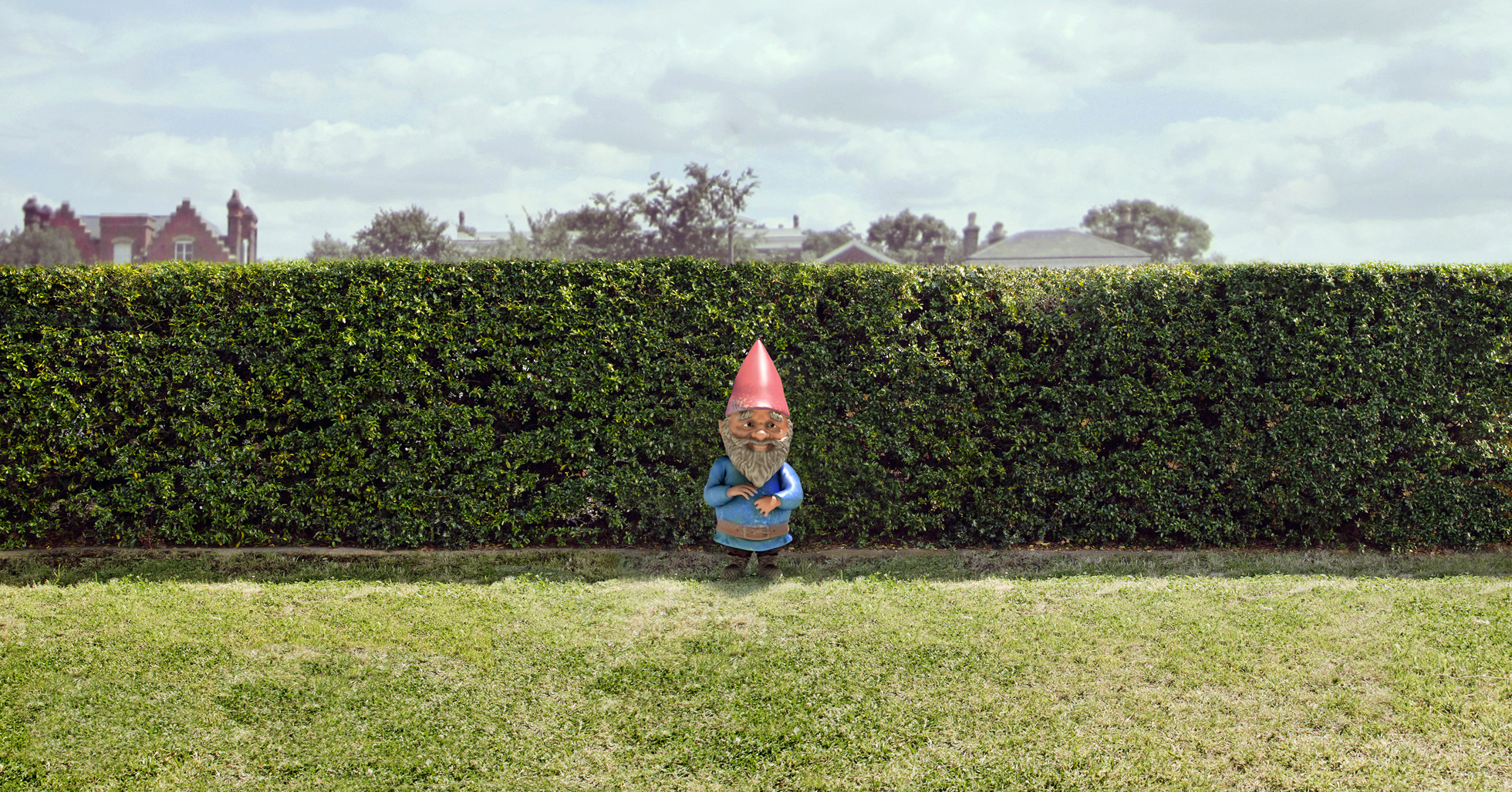 Garden gnome next to a home's lawn