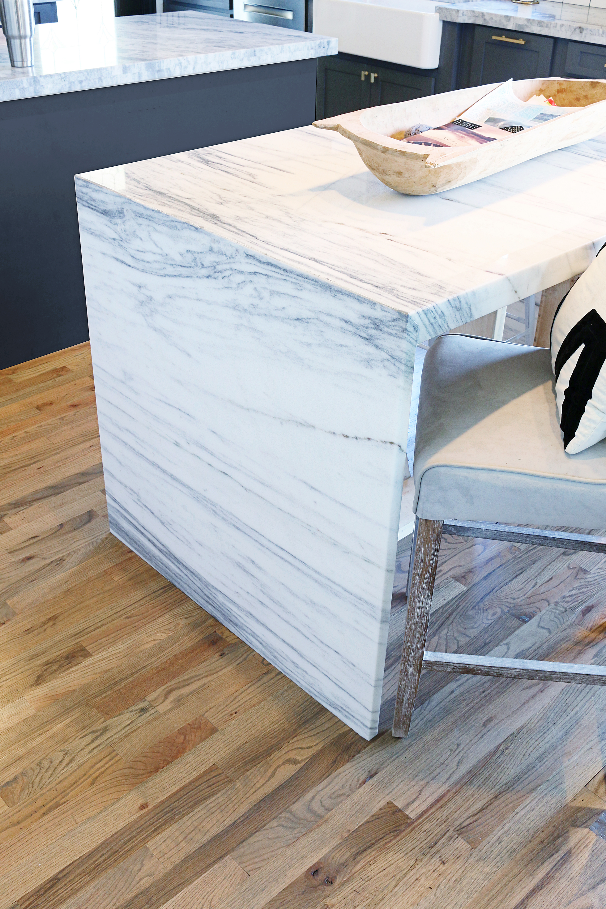 Gray kitchen countertops with wood floor