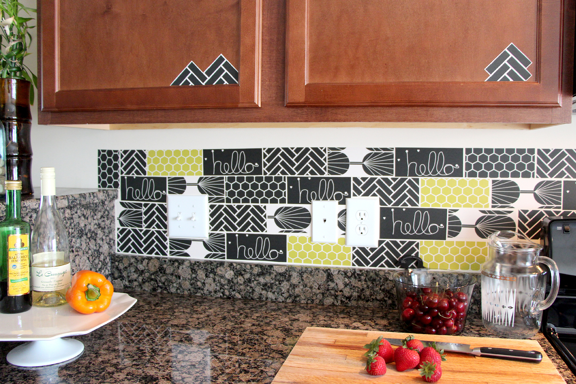 Black and green tile decals in a kitchen