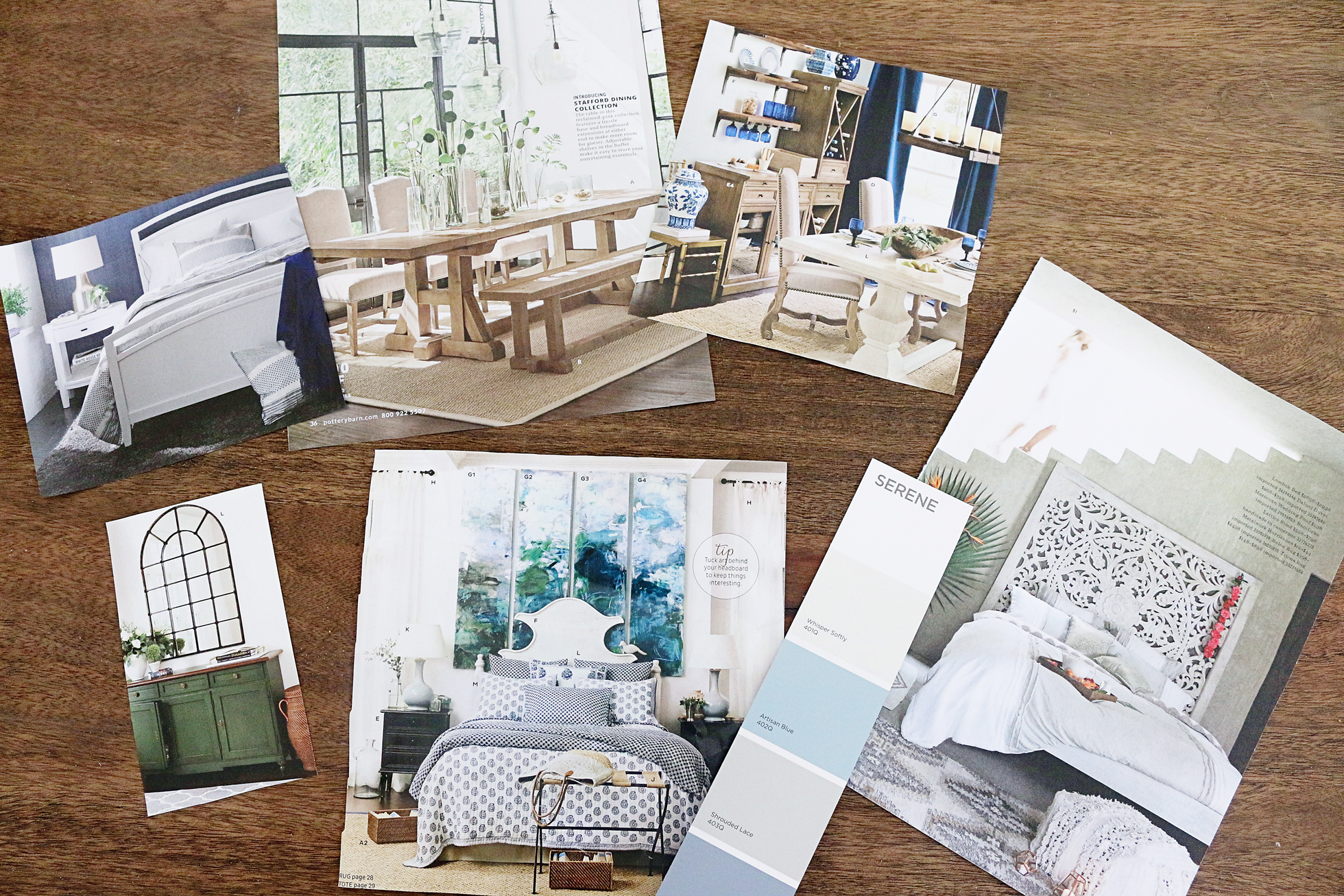 Paint swatches and magazine clippings scattered on a table