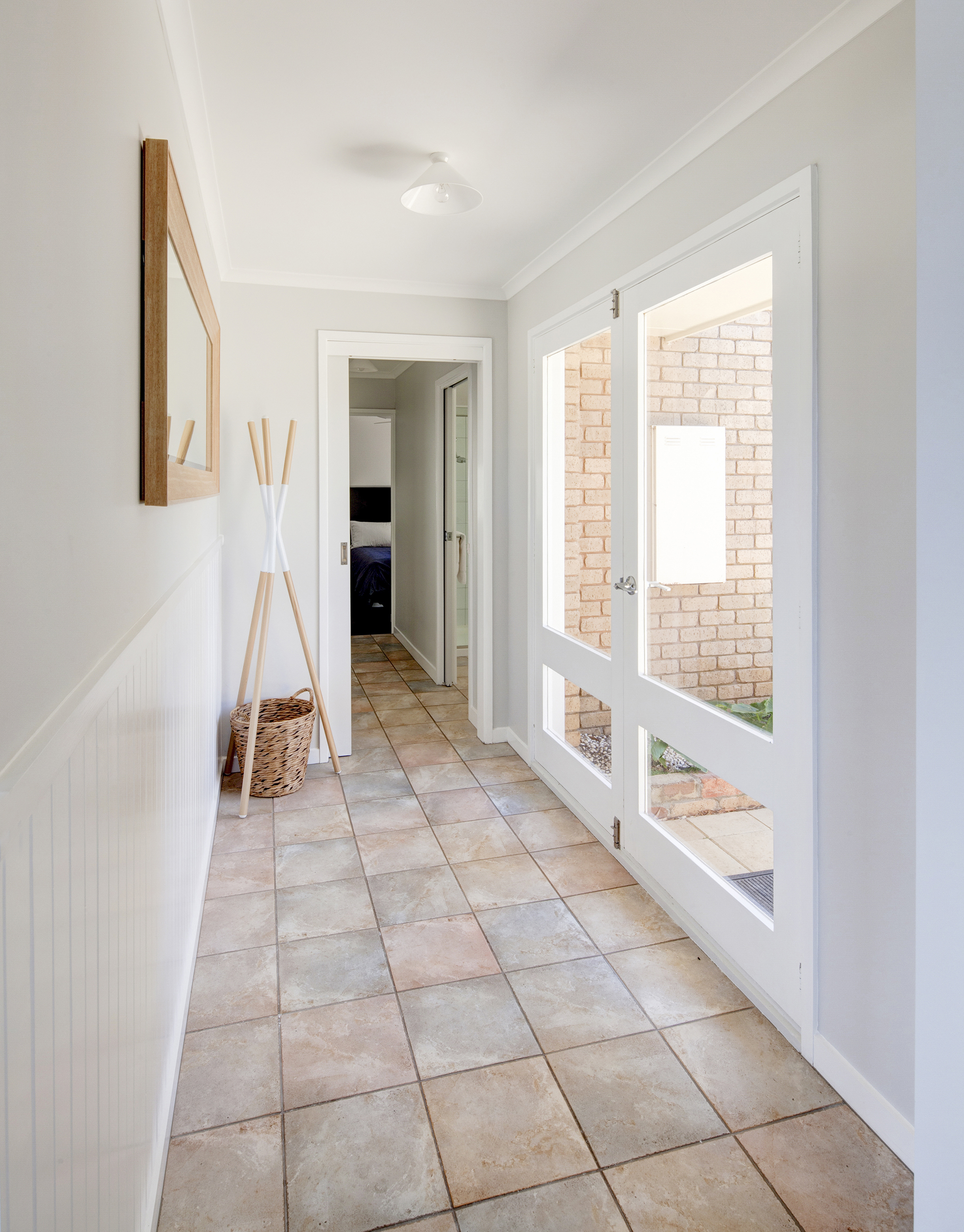 White hallway with stone tile | Keeping Clean with Dogs