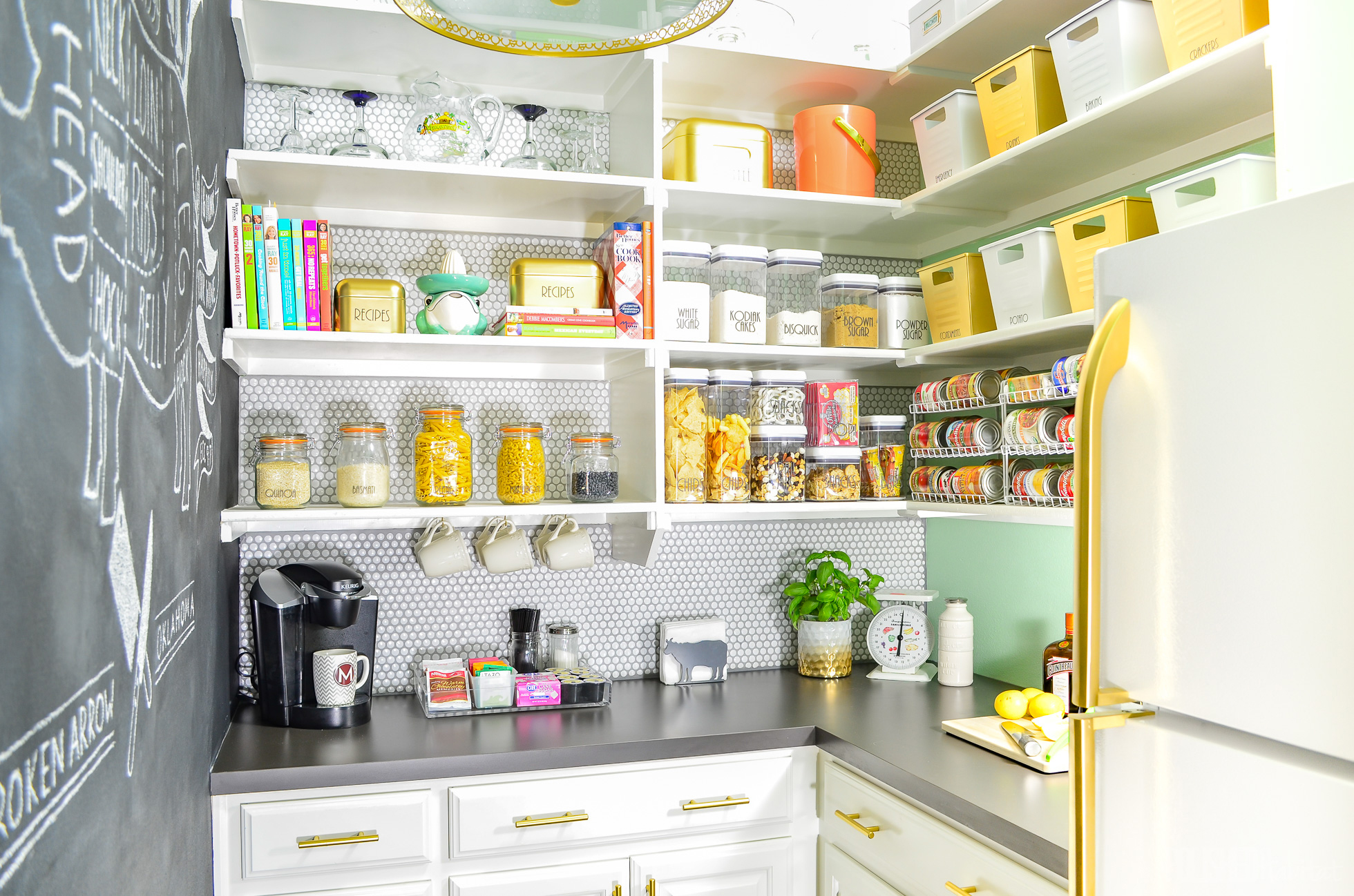 A bright green and gold pantry with food