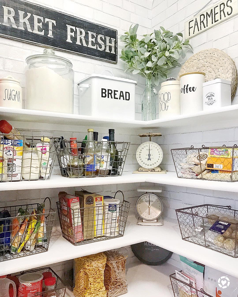 A black and white kitchen pantry with food