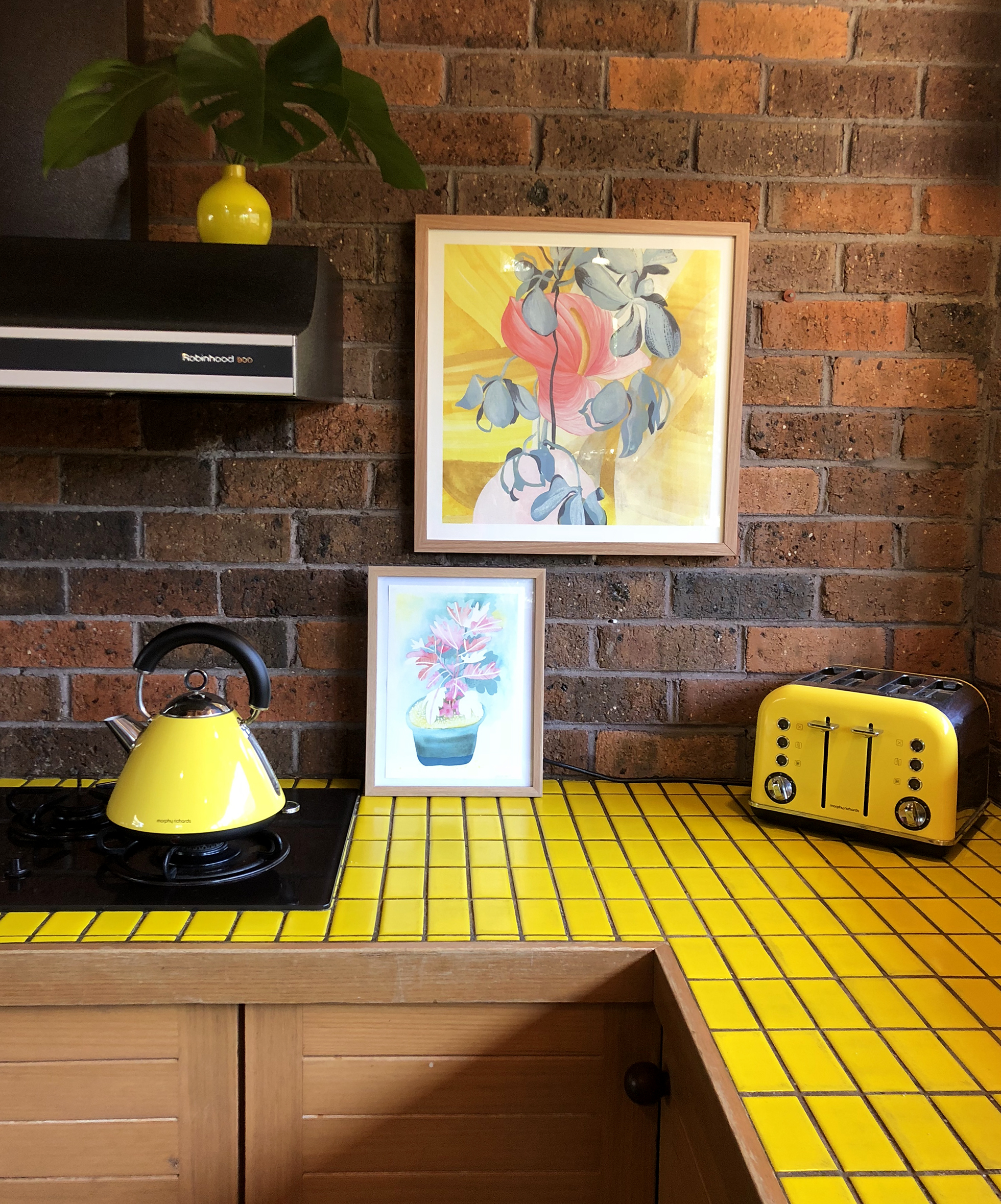Yellow mosaic counter tops in 80s retro kitchen