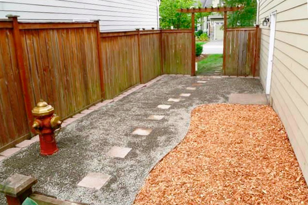 Dog-friendly yard with mulch and a fire hydrant