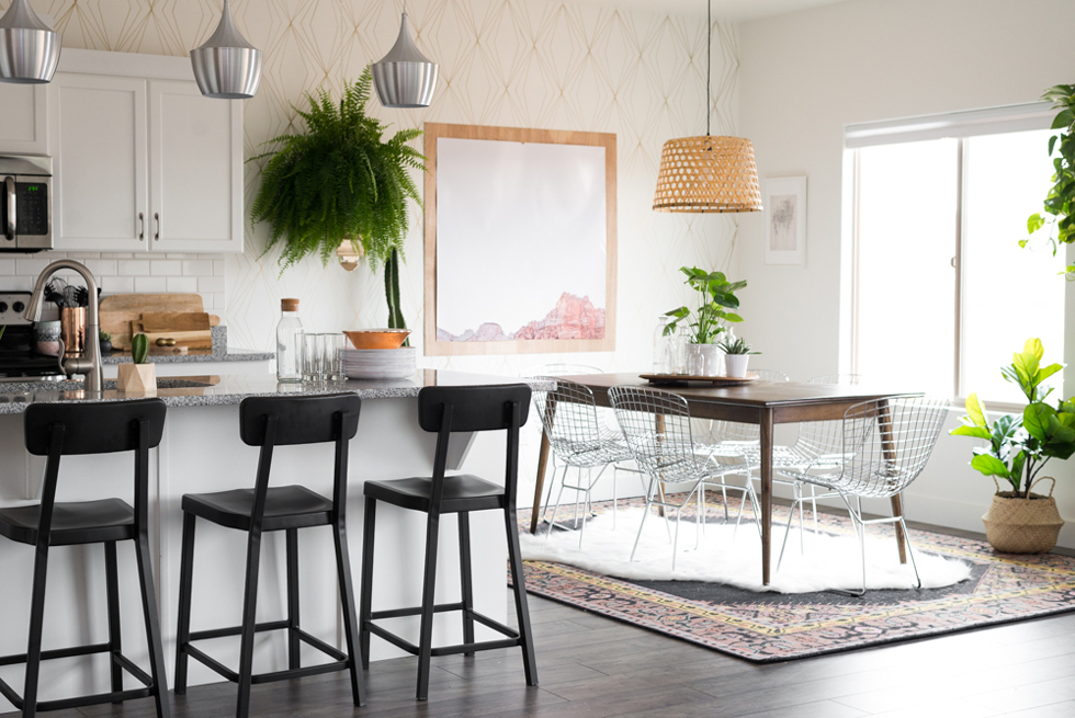 Kitchen with with cabinetry, greenery, and wallaper