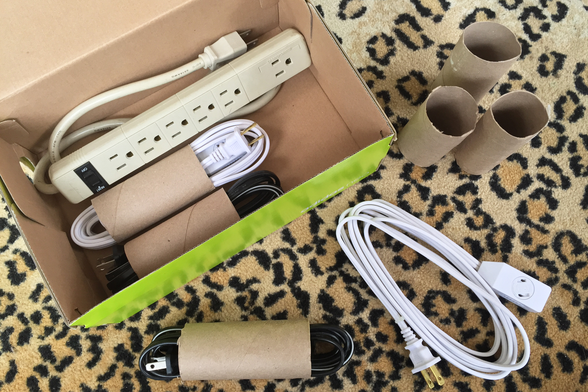 Organize power cords when moving by using toilet paper rolls