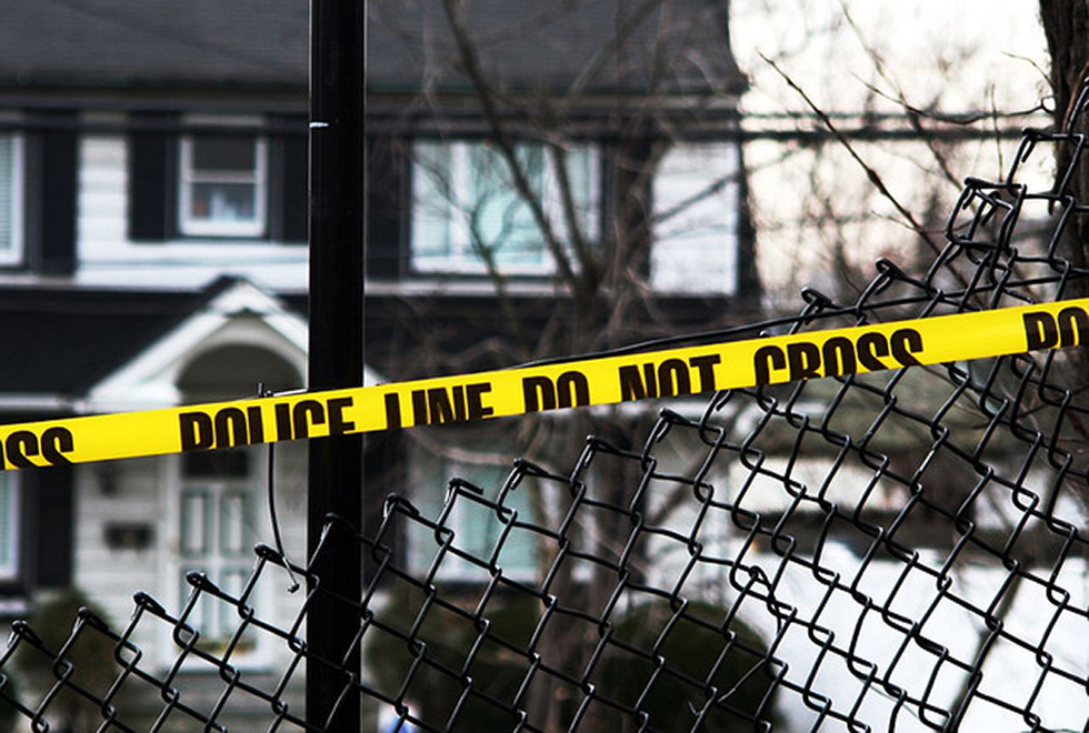 Crime scene tape outside of a house