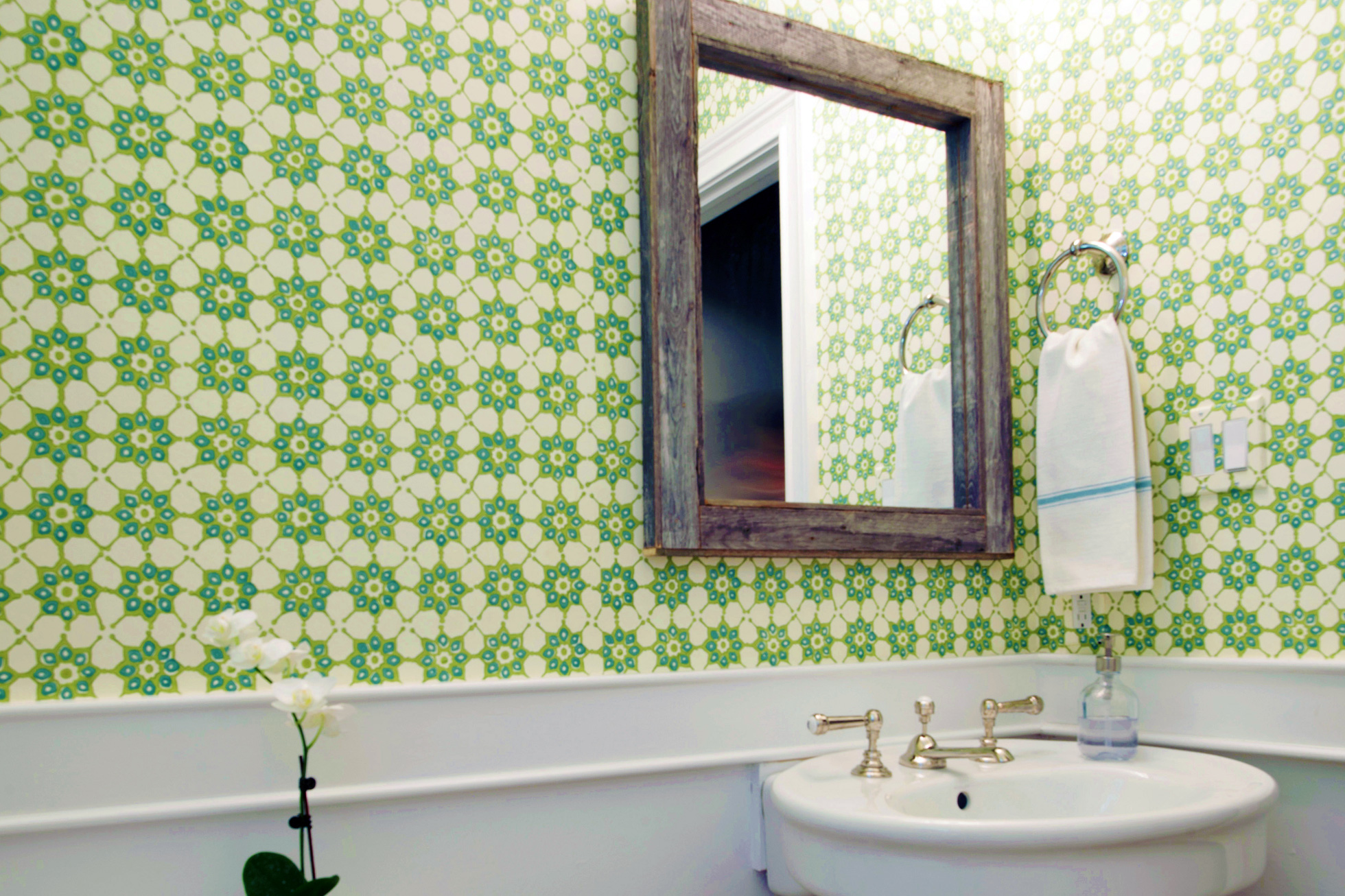 Powder room in Pennsylvania with patterned wallpaper