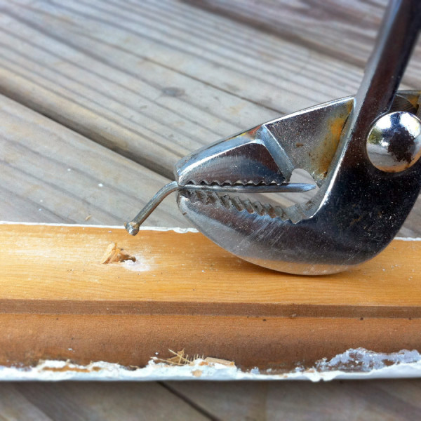 Carefully removing nails from wood