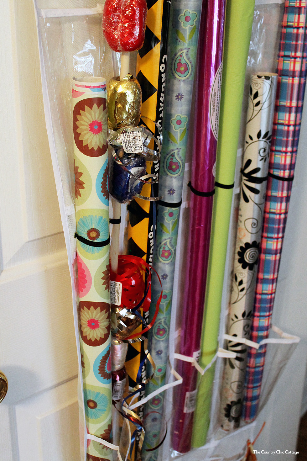 Clear shoe organizer used to store gift wrap