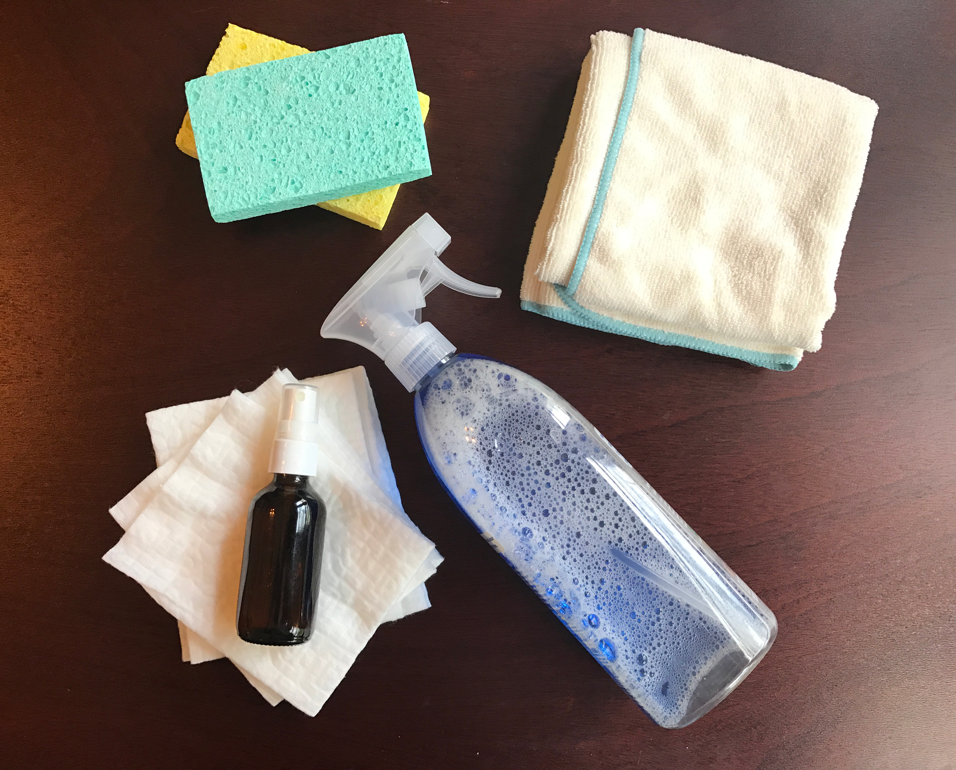 Dry sweeper cloths, sponges, and cloth on a wood table