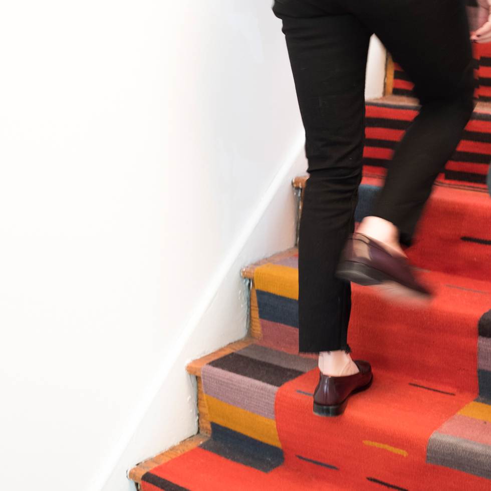 Woman walking up stairs with her custom runner