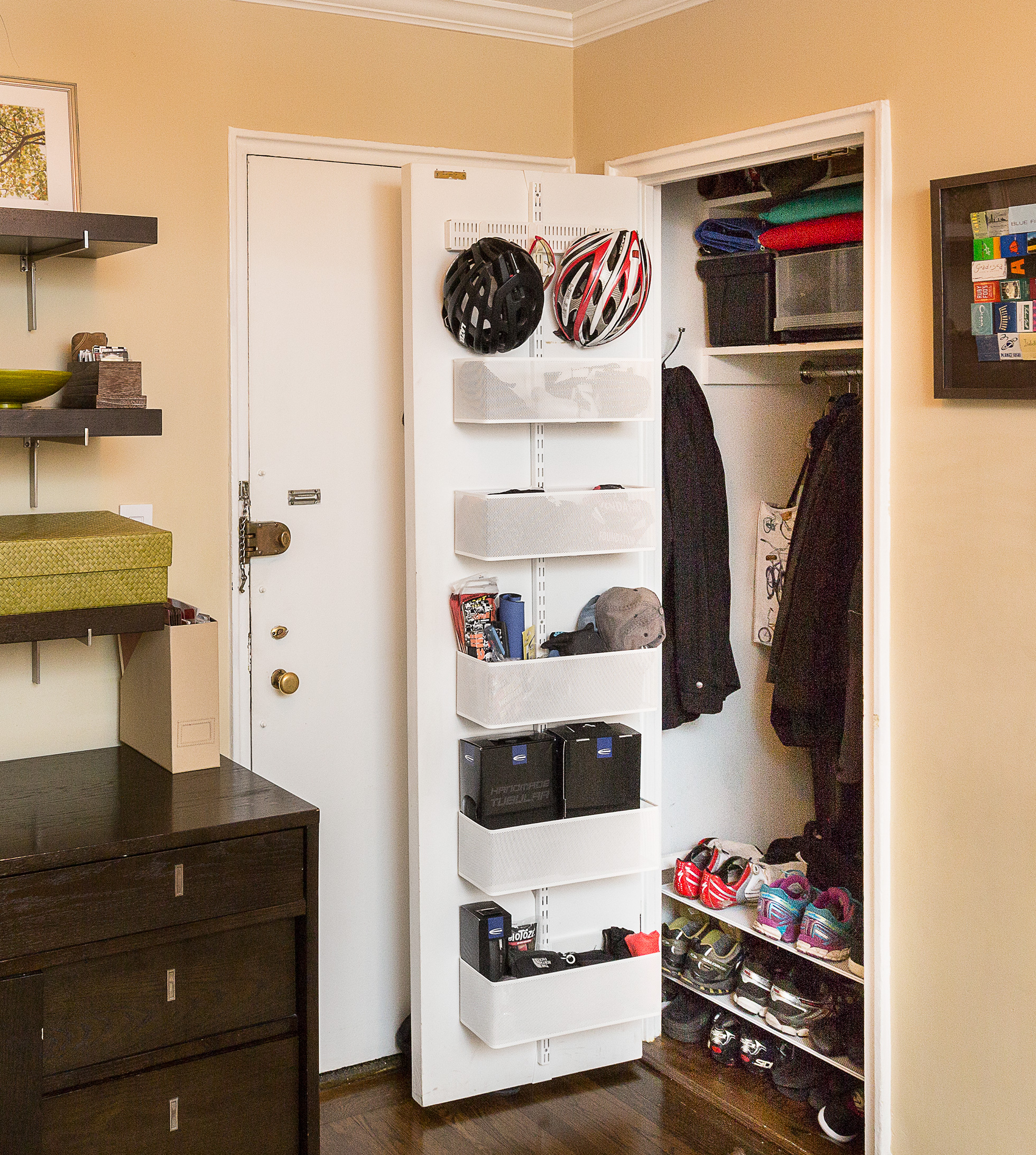 Cycling gear is stored in the family's front hall closet