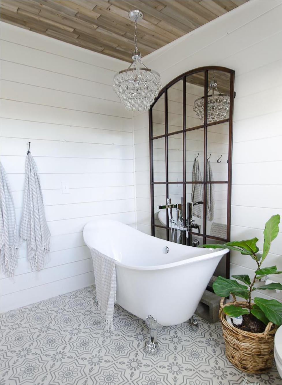 White bathroom with large white clawfoot tub