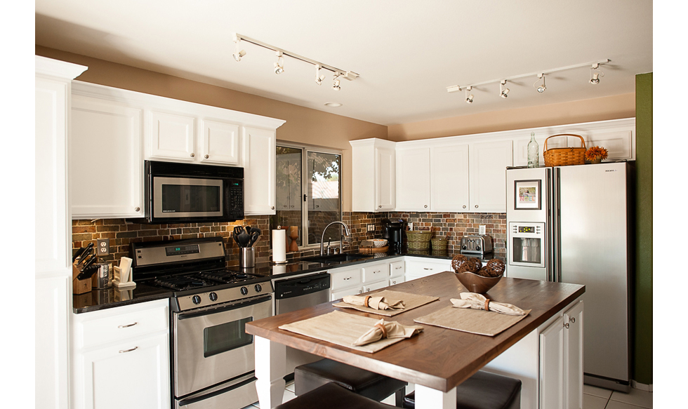Brick backsplash in transitional kitchen