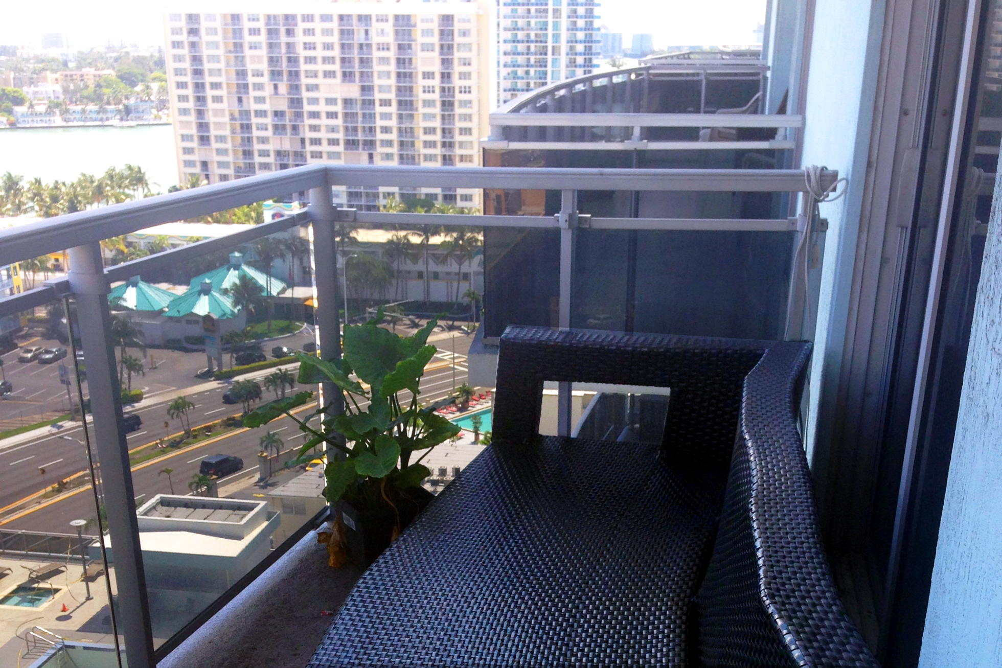 Balcony with black outdoor furniture and potted plant