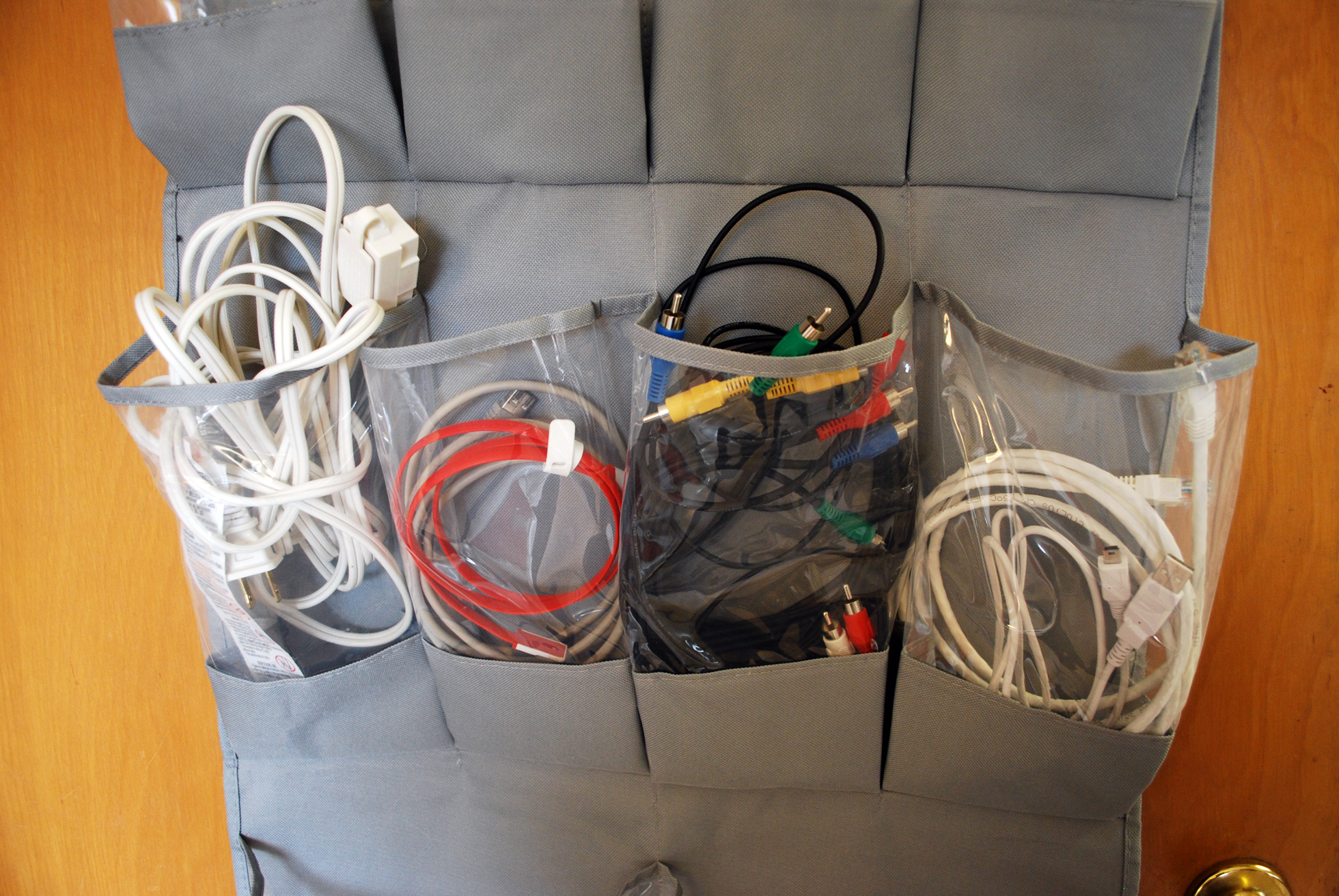 Over-the-door shoe organizer used to store computer cords